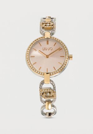 Round gold and silver Liu Jo watch with crystal-studded bezel and bracelet links, minimalist dial, and gold hour markers and hands.