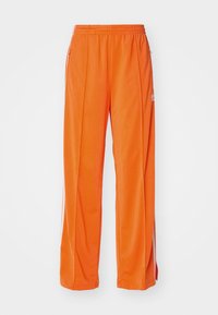 FIREBIRD LOOSE - Pantalones deportivos - orange