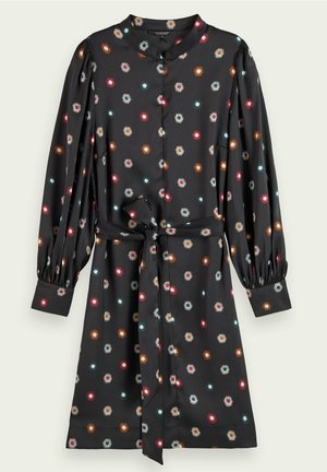 Dark long-sleeve dress with small colorful floral print, button closure, gathered cuffs, and a matching fabric belt tied at the waist.