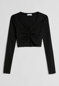 Černý žebrovaný krátký top s dlouhým rukávem, výstřihem do oblouku a knoflíky vpředu, se stahováním uprostřed. Hladká textura.