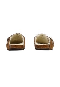 Zapatos marrones sin cordones con forma redondeada, forro de piel suave y suela plana. El exterior presenta una textura de cuero suave y un detalle mínimo.