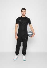 Nike Performance TOP  - Spordi T-särk - black/white