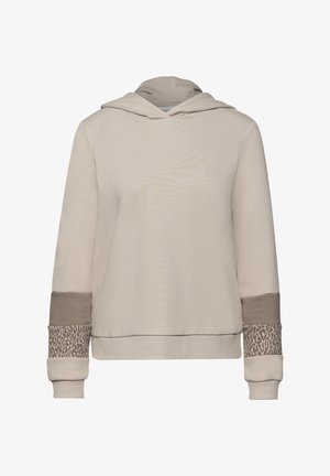 Vaalean beige huppari, jossa pitkät hihat ja tummemman beigen sekä leopardikuvioisen kankaan yksityiskohdat hihansuuissa.