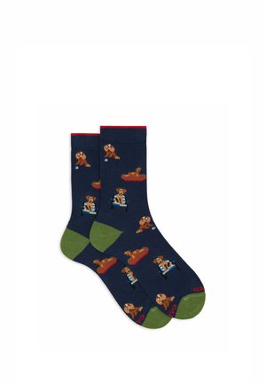 Calzini blu navy con motivi giocosi di cani, dettagli rossi sui polsini e suole verdi. Il materiale appare morbido ed elastico.