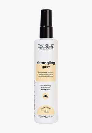Tangle Teezer ontklit spray in een witte fles met een zwarte pomp. Het etiket heeft gele accenten en tekst voor dik en krullend haar. 150ml.