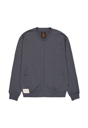 Grijze ritsjack gemaakt van zacht materiaal, met een ronde hals, zijzakken met knopen, geribbelde manchetten en een label op de onderzoom.