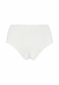 Vit bomullshigh-waisted trosor med vågig spetskant längs midjan och benöppningarna, med en slät textur och klassisk design.