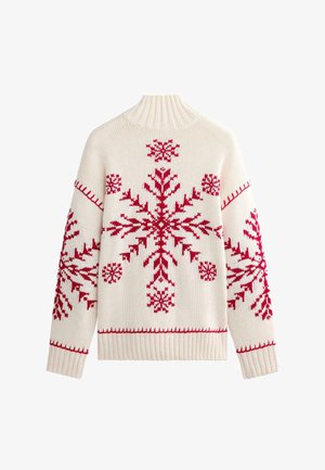 White knitted sweater featuring large red snowflake patterns and red stitching accents. High, ribbed collar and ribbed cuffs and hem.