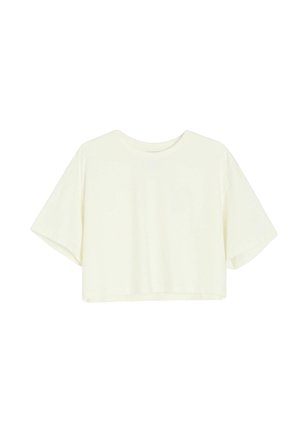 Krótka bluzka typu crop top w kolorze ecru, z krótkimi rękawami, okrągłym dekoltem i luźnym krojem, prezentowana na jednolitym białym tle.