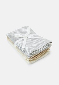 Set of three fabric dishcloths: two beige and one white with blue stripes, neatly folded and tied with a white ribbon. Soft cotton texture.