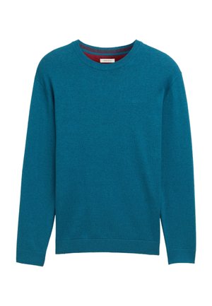 Tyrkysový svetr s kulatým výstřihem, dlouhými rukávy, žebrovanými manžetami a lemem. Měkká textura, zdobený decentním logem na hrudi.