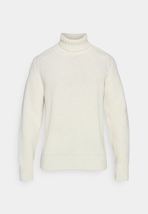 Cremefarvet sweatervaraiant med høj hals, ribbede manchetter og et struktureret strikkemønster. Har en afslappet pasform og sømløst design.