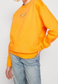 Nike Sportswear Mikina - orange