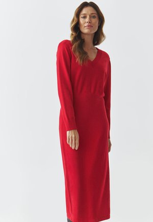 Red, long-sleeve knit dress with a V-neck and fitted waist, made from soft material. Features ribbed cuffs and a straight silhouette.