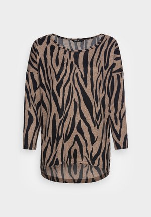 Top beige con strisce nere a zebra, maniche lunghe, scollo rotondo e orlo curvo. Realizzato in un tessuto morbido e strutturato.