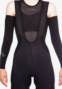 Black cycling suit with mesh upper, sleeveless design, and long sleeves. Features padded seat area and smooth elastic material for comfort.