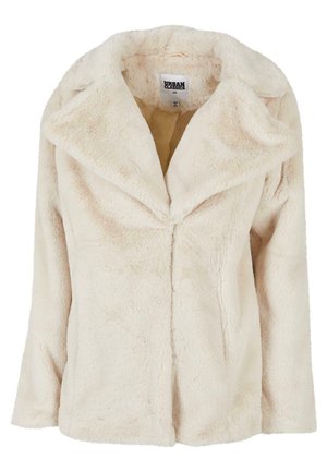 Helle beige Kunstfelljacke mit breitem Revers, langen Ärmeln und einer weichen, strukturierten Oberfläche. Verfügt über eine unverschlossene Frontöffnung.