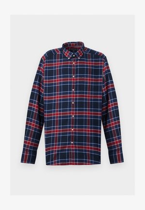 Košulja dugih rukava s kariranim uzorkom u tamnoplavoj, crvenoj i bijeloj boji, sa dugmićima na ovratniku i jednim džepom na prsima. Napravljena je od mekog materijala.