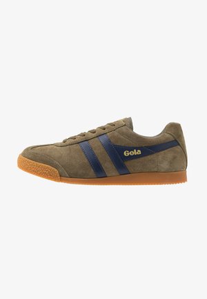 Suede athletic shoe in olive green with blue leather stripes. Features textured gum rubber sole. Gold logo on side. Classic design.