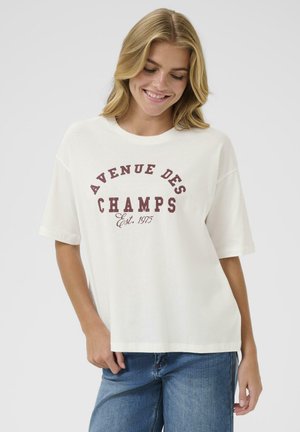 T-shirt en coton blanc à manches courtes, présentant un graphique bordeaux avec l'inscription "AVENUE DES CHAMPS Est. 1975" dans un design arrondi. Coupe décontractée.