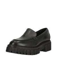 Zapato negro de piel tipo slip-on con puntera redonda y suela de goma gruesa y acanalada. La parte superior presenta costuras mínimas y un acabado suave.