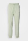 NOMPIO - Pantaloni sportivi - light/pastel green