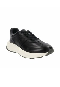 Sneaker in pelle nera con punta arrotondata, lacci testurizzati e una suola intermedia bianca. Presenta un motivo di battistrada poco profondo sulla suola.