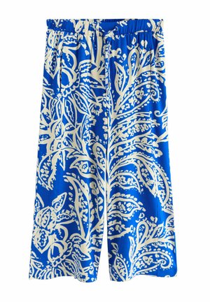 Sinised laiade pükste säärega valgete lille- ja paisleimustritega, kummiga vöökohaga ja küljetaskutega.