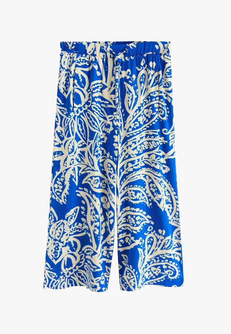 Pantalon large bleu avec motifs floraux blancs et motifs cachemire, taille élastique et poches latérales.