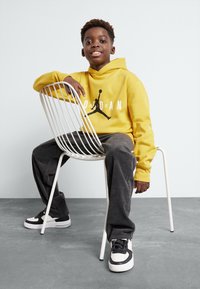 Jordan JUMPMAN UNISEX - Sudadera - yellow ochre