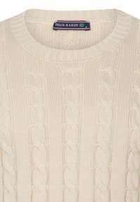 Cream-colored knitted sweater featuring a cable knit pattern, ribbed neckline, and tag labeled "FELIX HARDY," size M.
