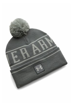 Gray knit beanie with pom-pom, cuffed edge, "Under Armour" text band, and Under Armour logo patch on front cuff.