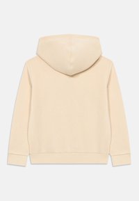Beige huvtröja med långa ärmar, ribbade mudd och nederkant, visad bakifrån mot en vit bakgrund.