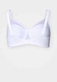 White bra with underwire, adjustable straps, and a textured floral pattern on the band. Smooth cups and clasp closure in the back.