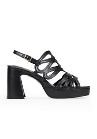 Black heeled sandal featuring leather straps with cut-out design, adjustable ankle buckle, and a thick platform sole.