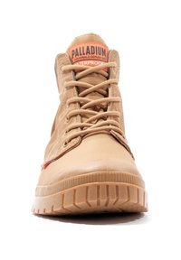 Tan waterproof ankle boots with round toe, textured rubber sole, and prominent side stitching. Features braided laces and logo tag.