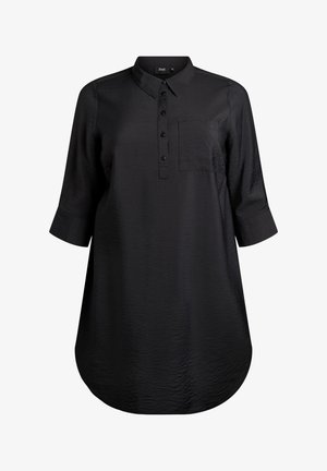 Must mustri ja kaelusega must pluus, nööpidega esiosas, 3/4 pikkuses varrukad, üks rinnaTasku ja ümar äär. Valmistatud tekstureeritud kangast.