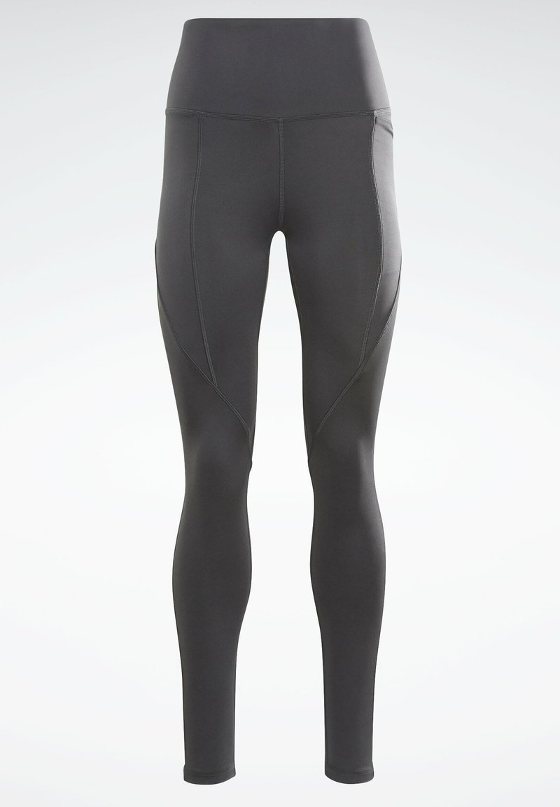 Leggings noirs taille haute en matière lisse et extensible. Présentent des coutures plates et des poches latérales. Design ajusté avec une jambe fuselée.