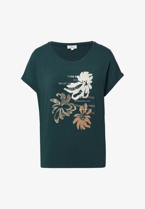 Dunkelgrünes kurzärmliges Shirt mit Rundhalsausschnitt, floralem Grafikdesign in Beige und Braun sowie aufmunterndem Text über Frieden und Ruhe auf der Vorderseite.