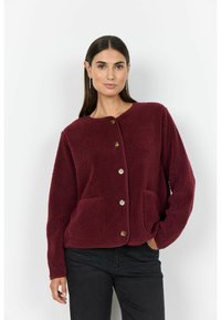 Burgundy button-up fleece jacket with a round neckline, two front pockets, and a textured surface. Features gold-tone buttons.