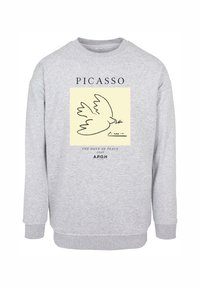 Grijze sweatshirt van een katoenmix, met een centrale illustratie van een duif en zwarte tekst die "Picasso" en "De Duif van de Vrede" omcirkelt.