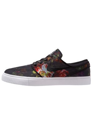 Sort lav-sko med flerfarvet blomsterprint, sorte snørebånd og hvid gummi sål, set fra siden.