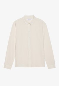 Camicia a maniche lunghe beige chiaro in un tessuto testurizzato, con colletto classico e pattina con bottoni abbinati.