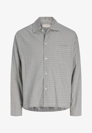 Overhemd met lange mouwen, kleine zwart-witte ruitjes en een borstzak.