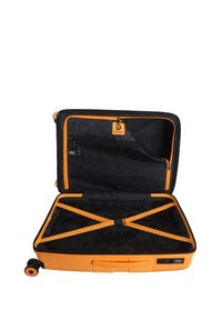 Orange hardshell suitcase with a black interior, black zipper, and orange accents. Features a cross-strap and built-in combination lock.