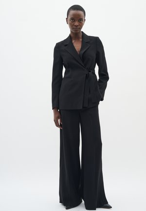 BRIEZIW SLIT - Stoffhose - black