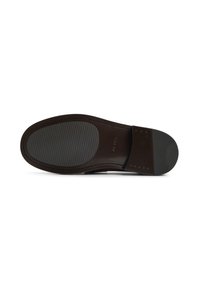 Brown leather shoe sole featuring a smooth surface with ridged texture for grip, embossed logo detail, and a sleek, rounded shape.