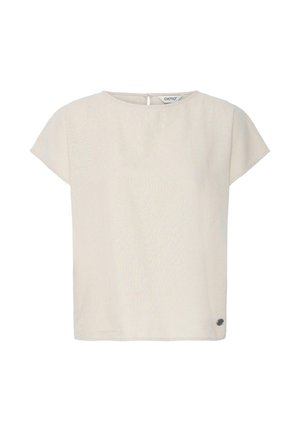 Beež lühikeste varrukatega pluus ümmarguse kaelakaarega ja väikese sildiga allääre lähedal valgel taustal.