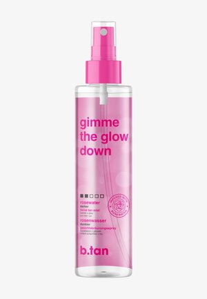 Clear plastic spray bottle with pink liquid labeled "gimme the glow down," rosewater facial tan mist by b.tan, with a pink spray nozzle.