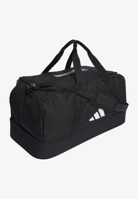 Borsa a sacca nera con chiusura a zip, spallacci regolabili e tessuto texturizzato. Presenta un logo bianco e una base robusta.